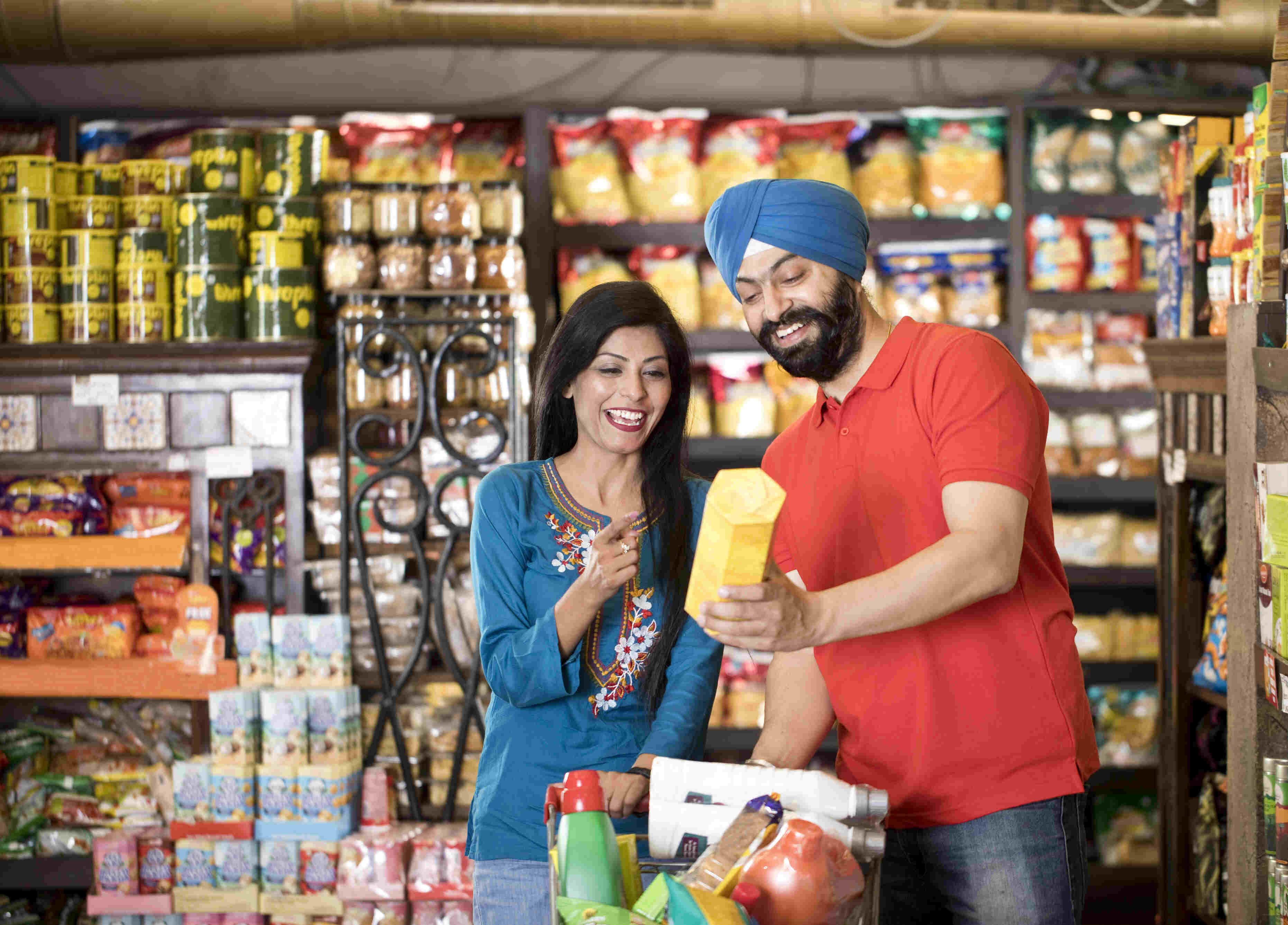 Couples reading food label