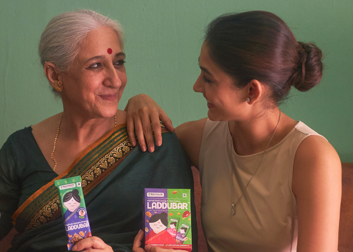 Grandmother and new mother with Laddubars nutrition bars for new mothers