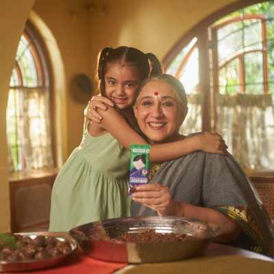 Grandma and granddaughter with laddubars snack bars