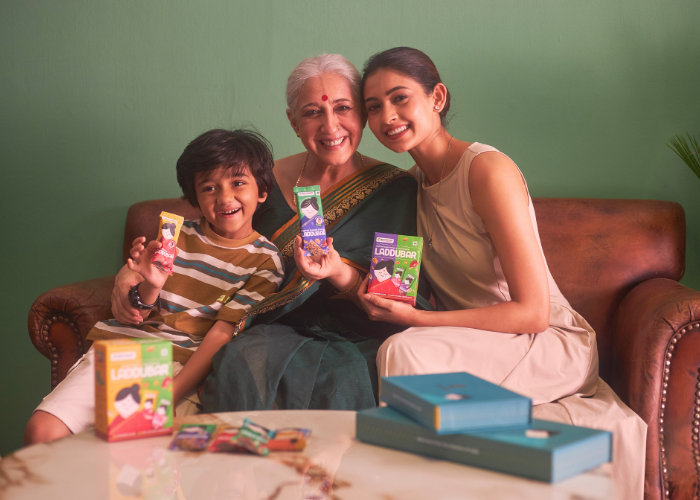 Mother and son with grandma holding Laddubar snack bars